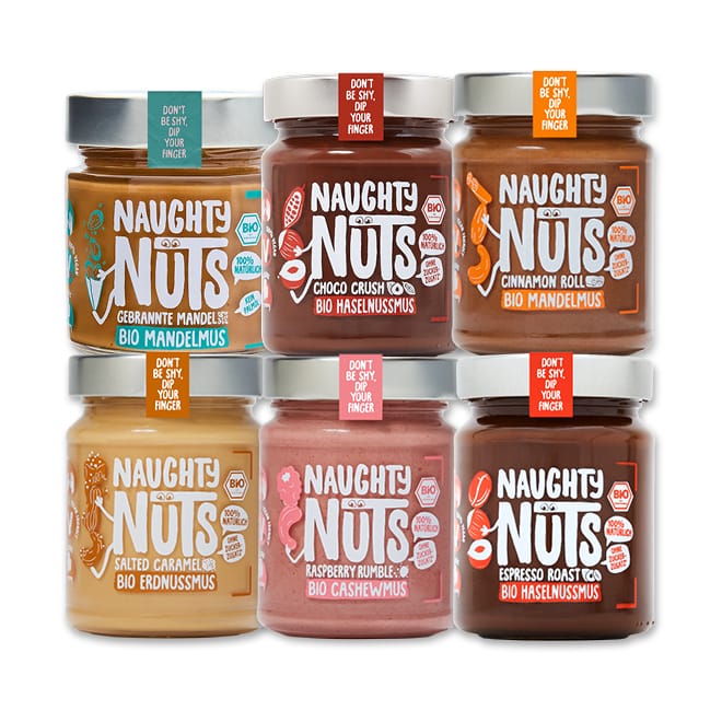 Sechs Gläser Naughty Nuts Nussmus in verschiedenen Geschmacksrichtungen